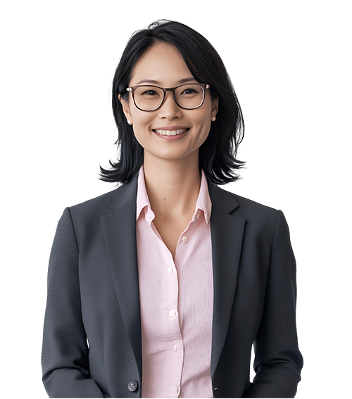 smiling asian businesswoman wearing glasses and a dark gray blazer over a light pink shirt
